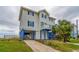 Two-story beach home with driveway and fenced yard at 144 Palmetto Blvd, Edisto Island, SC 29438