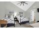 Two twin beds in a spacious bedroom with a ceiling fan at 9002 Palmetto Dr # 512, Isle of Palms, SC 29451