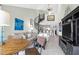 Open living room featuring a spiral staircase, comfy seating, and a large TV at 9002 Palmetto Dr # 512, Isle of Palms, SC 29451