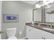Updated bathroom with granite countertop, double vanity, and decorative mirror at 9002 Palmetto Dr # 512, Isle of Palms, SC 29451