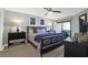 King bedroom with balcony access, ceiling fan, and en-suite bathroom at 9002 Palmetto Dr # 512, Isle of Palms, SC 29451