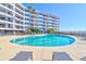 Inviting kidney-shaped pool with plenty of lounge chairs at 9002 Palmetto Dr # 512, Isle of Palms, SC 29451