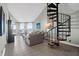 Spacious living area with spiral staircase, ocean views, and comfortable seating at 9002 Palmetto Dr # 512, Isle of Palms, SC 29451
