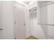 White closet with shelves and hanging rod at 9002 Palmetto Dr # 512, Isle of Palms, SC 29451