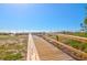 Wooden walkway to beach with dune landscaping at 9002 Palmetto Dr # 512, Isle of Palms, SC 29451