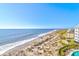 Aerial view showcasing beach, pool, and building location at 9002 Palmetto Dr # 512, Isle of Palms, SC 29451