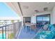 Private balcony with ocean view, seating, and dining table at 9002 Palmetto Dr # 512, Isle of Palms, SC 29451