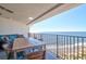 Oceanfront balcony with table and chairs, perfect for relaxation at 9002 Palmetto Dr # 512, Isle of Palms, SC 29451