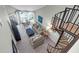 Open living area with spiral staircase and ocean view at 9002 Palmetto Dr # 512, Isle of Palms, SC 29451
