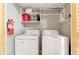 Convenient laundry closet with washer, dryer, and shelving at 9002 Palmetto Dr # 512, Isle of Palms, SC 29451