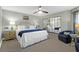 King bedroom with mirrored closet and seating area at 9002 Palmetto Dr # 512, Isle of Palms, SC 29451
