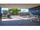 Covered patio area with picnic table and trash can at 9002 Palmetto Dr # 512, Isle of Palms, SC 29451