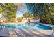 Community pool with surrounding lush trees and landscaping at 1151 Saint Pauls Parrish Ln, Johns Island, SC 29455