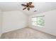 Spacious bedroom with vaulted ceiling, ceiling fan, and large window at 1151 Saint Pauls Parrish Ln, Johns Island, SC 29455