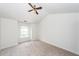 Well-lit bedroom featuring a ceiling fan and a large window at 1151 Saint Pauls Parrish Ln, Johns Island, SC 29455