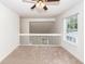 Spacious loft area with carpeted floor, ceiling fan, and window at 1151 Saint Pauls Parrish Ln, Johns Island, SC 29455