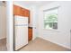 Eat-in kitchen with white refrigerator and exterior access at 1151 Saint Pauls Parrish Ln, Johns Island, SC 29455