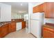 Open concept kitchen with white appliances and view to living room at 1151 Saint Pauls Parrish Ln, Johns Island, SC 29455