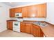 Modern kitchen with ample wood cabinets and corner sink at 1151 Saint Pauls Parrish Ln, Johns Island, SC 29455