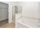 Bathroom with shower, tub, and linen closet at 1151 Saint Pauls Parrish Ln, Johns Island, SC 29455