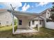 Covered patio with ceiling fan, adjacent to house and backyard at 1151 Saint Pauls Parrish Ln, Johns Island, SC 29455