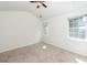 Main bedroom with vaulted ceiling, carpeting, and window at 1151 Saint Pauls Parrish Ln, Johns Island, SC 29455