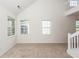 Bright living room with vaulted ceilings and carpeting at 1151 Saint Pauls Parrish Ln, Johns Island, SC 29455