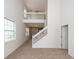 Two story living room with loft and staircase at 1151 Saint Pauls Parrish Ln, Johns Island, SC 29455