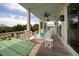 Spacious deck with rocking chairs, offering scenic views at 3002 Palmetto Blvd # 6, Edisto Beach, SC 29438