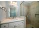 Small bathroom with single vanity and walk-in shower at 3002 Palmetto Blvd # 6, Edisto Beach, SC 29438