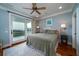 Spacious bedroom with king bed, ocean view, and private balcony at 3002 Palmetto Blvd # 6, Edisto Beach, SC 29438