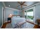 Bright bedroom with ocean views, king-size bed, and private balcony access at 3002 Palmetto Blvd # 6, Edisto Beach, SC 29438