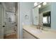 Elegant bathroom with marble shower, single vanity, and modern fixtures at 3002 Palmetto Blvd # 6, Edisto Beach, SC 29438