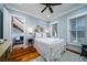 Charming bedroom with white metal bed frame and hardwood floors at 3002 Palmetto Blvd # 6, Edisto Beach, SC 29438