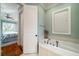 Bathroom with a soaking tub and access to bedroom at 3002 Palmetto Blvd # 6, Edisto Beach, SC 29438