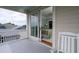 Private balcony with rocking chairs and stunning ocean views at 3002 Palmetto Blvd # 6, Edisto Beach, SC 29438