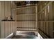 Basic outdoor shower with wooden walls and shelves at 3002 Palmetto Blvd # 6, Edisto Beach, SC 29438