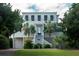 Two story beach home with a large front porch and attached garage at 3002 Palmetto Blvd # 6, Edisto Beach, SC 29438