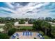 Elevated view of a refreshing pool and spacious patio with lounge chairs, perfect for relaxation at 3002 Palmetto Blvd # 6, Edisto Beach, SC 29438