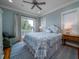 Main bedroom with king-size bed and access to balcony at 3002 Palmetto Blvd # 6, Edisto Beach, SC 29438
