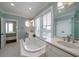 Spa-like bathroom with soaking tub, double vanity, and ocean view at 3002 Palmetto Blvd # 6, Edisto Beach, SC 29438