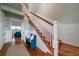Elegant staircase with white railing and hardwood floors at 3002 Palmetto Blvd # 6, Edisto Beach, SC 29438