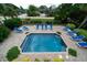 Inviting, refreshing square pool surrounded by a brick patio at 3002 Palmetto Blvd # 6, Edisto Beach, SC 29438