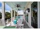 Relaxing covered porch with rocking chairs and outdoor seating at 3002 Palmetto Blvd # 6, Edisto Beach, SC 29438