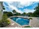 Relaxing rectangular pool with brick patio and lounge chairs at 3002 Palmetto Blvd # 6, Edisto Beach, SC 29438