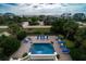 Elevated view of a refreshing pool and spacious patio with lounge chairs, perfect for relaxation at 3002 Palmetto Blvd # 6, Edisto Beach, SC 29438