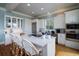 Kitchen island with white quartz countertop and seating for four at 3002 Palmetto Blvd # 6, Edisto Beach, SC 29438
