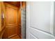 Wood-paneled elevator with metal gate at 3002 Palmetto Blvd # 6, Edisto Beach, SC 29438