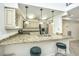 Modern kitchen with granite countertops and stainless steel appliances at 377 King St # 101, Charleston, SC 29401