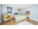 Cozy bedroom with vintage decor and hardwood floors at 377 King St # 101, Charleston, SC 29401